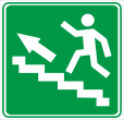 Направление к эвакуационному выходу по лестнице. Эвакуационный знак безопасности.